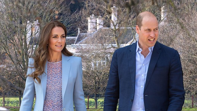 Kate and William in front of their pink house