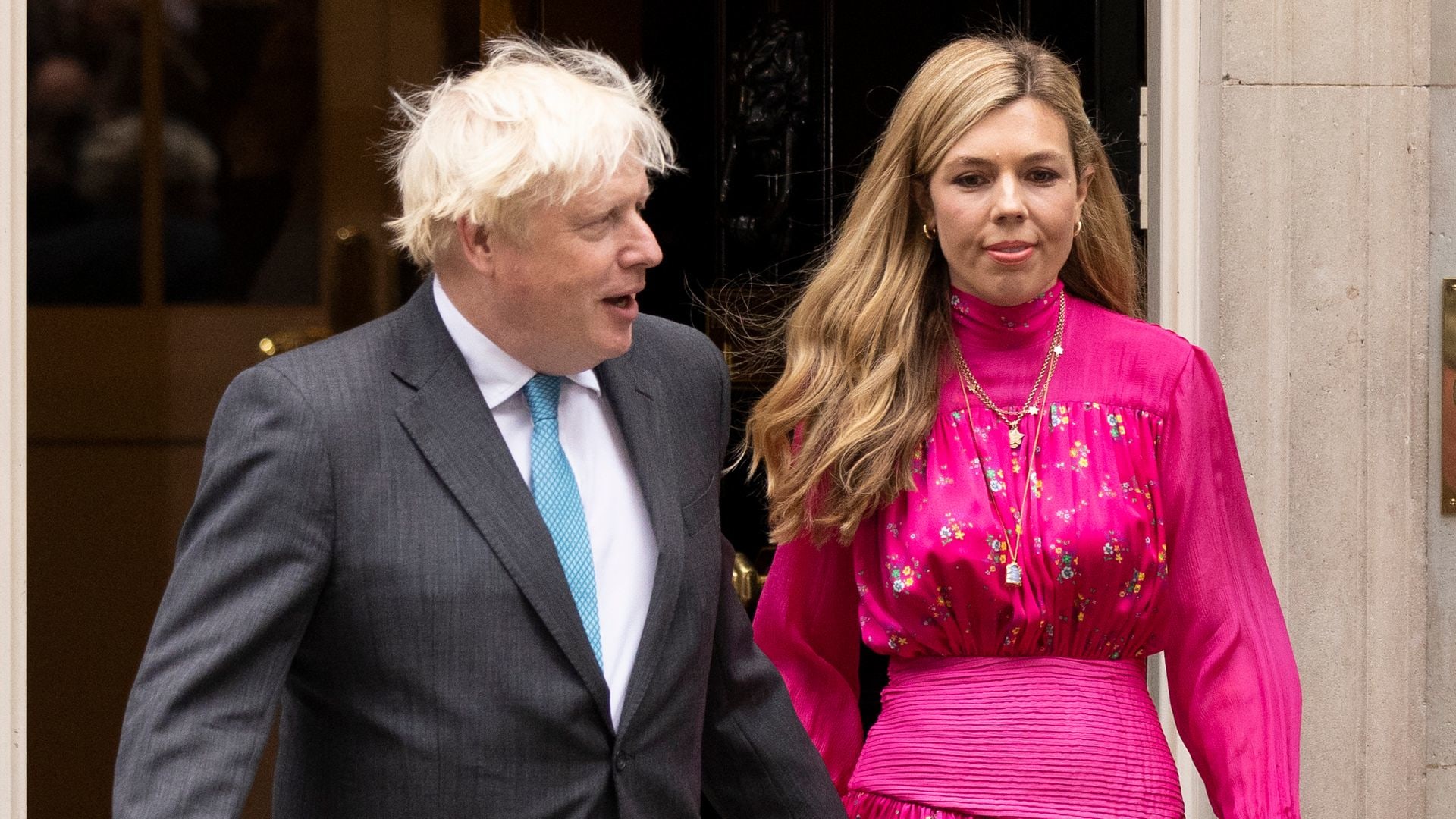 Boris Johnson arrives with his wife Carrie Johnson as he prepares to deliver a farewell address