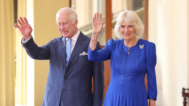 King Charles and Queen Camilla wave during state visit