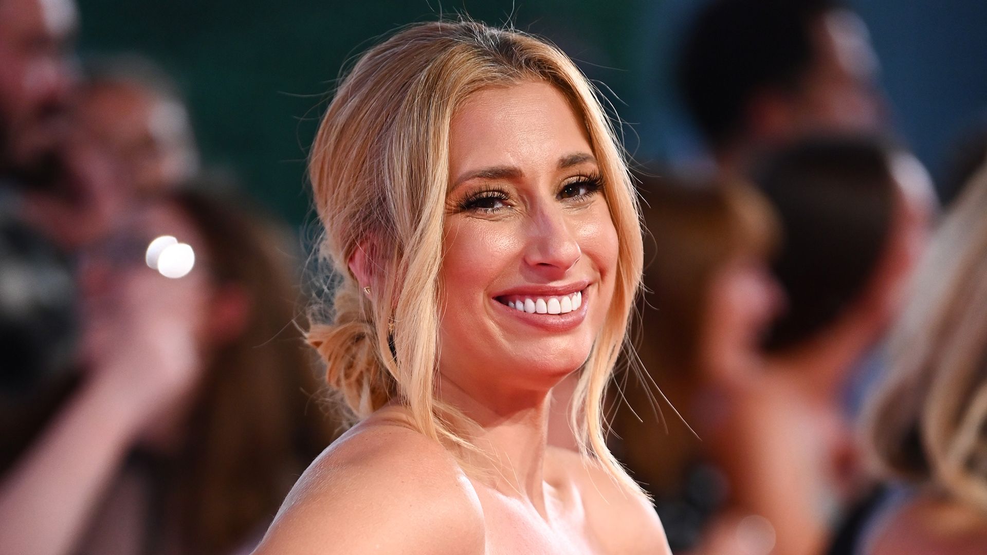 Stacey Solomon smiling on the red carpet at the NTA's 2023 