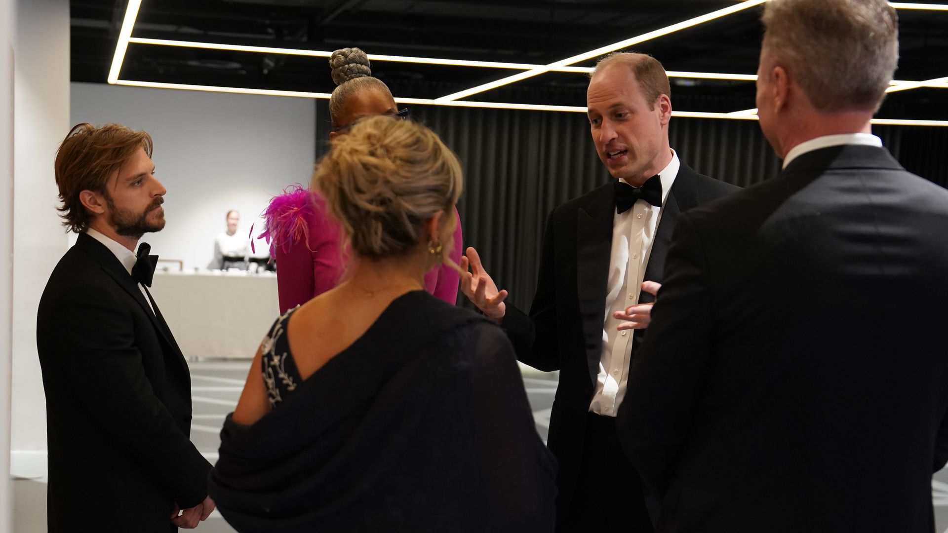 Prince William speaking with people