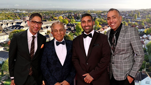 Sid Siddiqui with three sons with houses backdrop