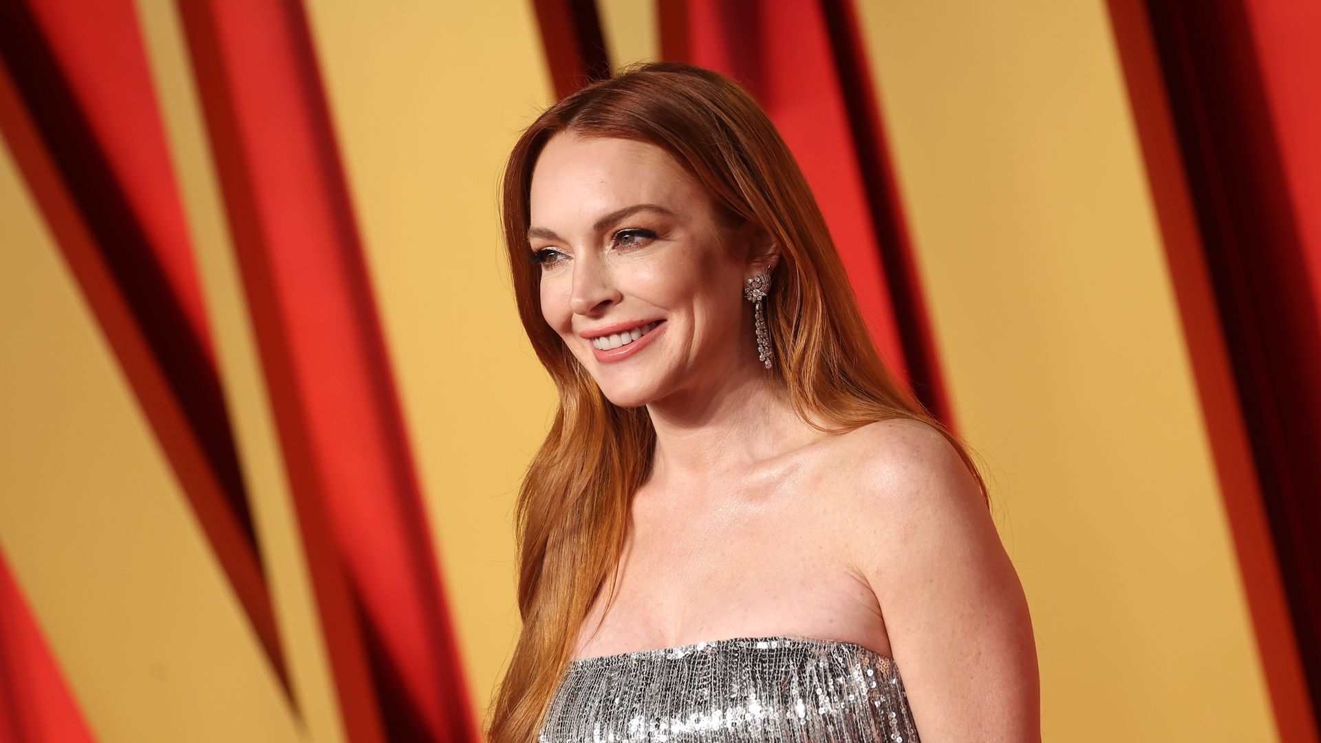 BEVERLY HILLS, CALIFORNIA - MARCH 10: Lindsay Lohan attends the 2024 Vanity Fair Oscar Party Hosted By Radhika Jones at Wallis Annenberg Center for the Performing Arts on March 10, 2024 in Beverly Hills, California. (Photo by Amy Sussman/Getty Images)