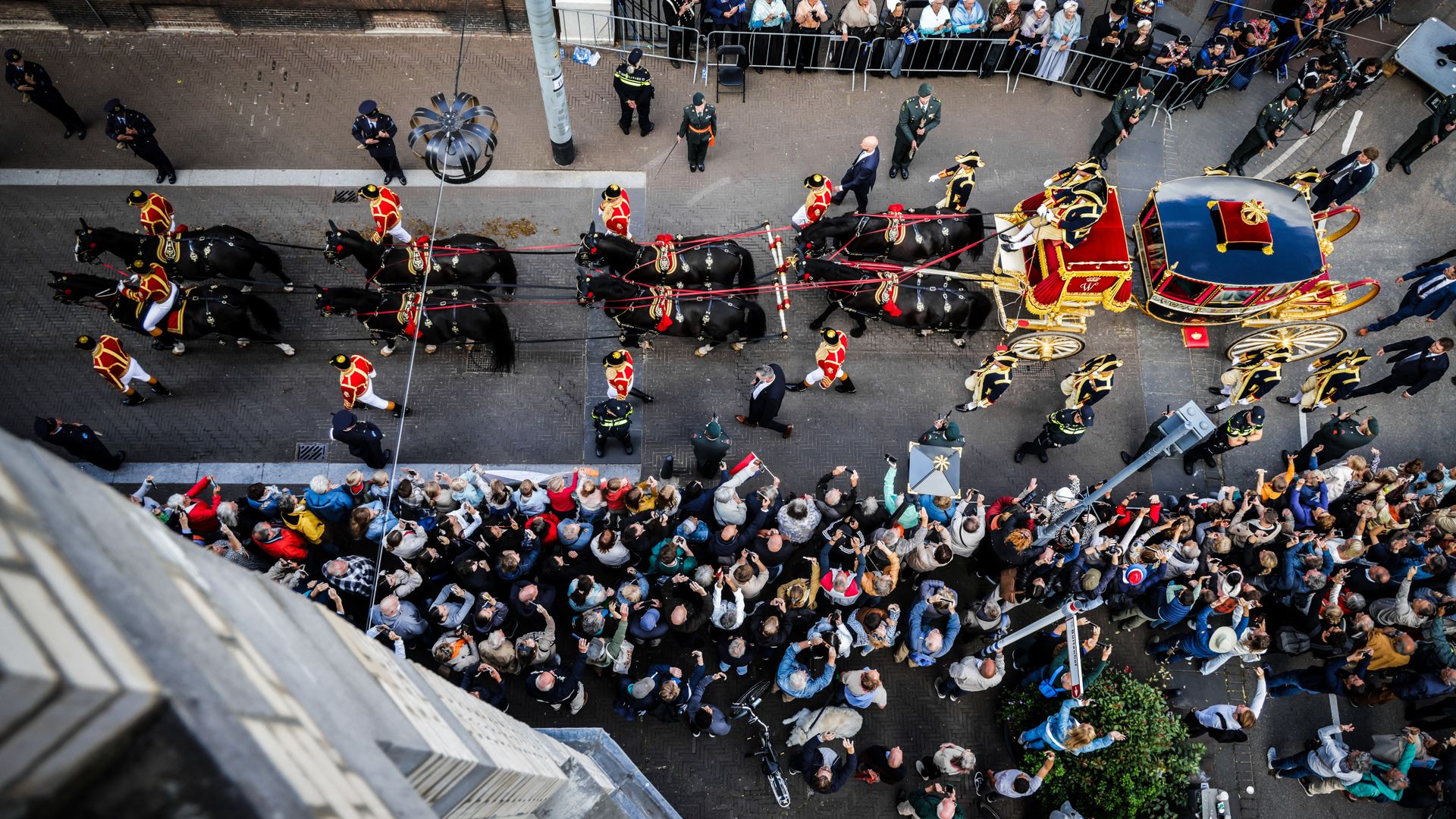 The glass coach carrying King Willem-Alexander of the Netherlands, Queen Maxima of the Netherlands and Princess Amalia of the Netherlands drives to the Royal Theater for the Speech from the throne to members of the Dutch Senate and House of Representatives for the celebration of Prince's Day (Prinsjesdag) in the Hague