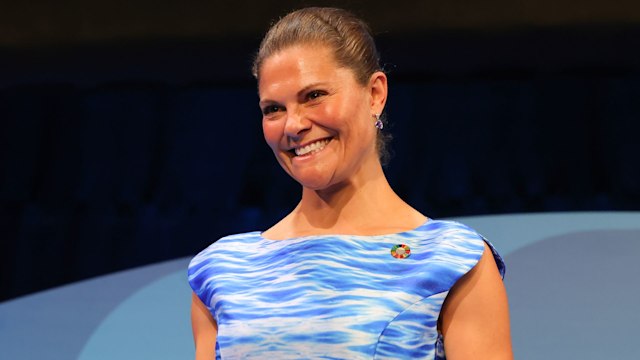 Crown Princess Victoria smiling in blue dress