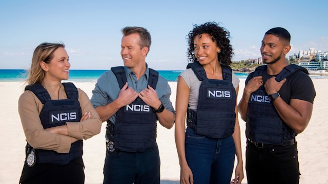 L-R: Tuuli Narkle as AFP LiaisonÂ Officer Constable Evie Cooper, Todd Lasance as AFP LiaisonÂ Officer Sergeant JimÂ  'JD'Â Dempsey, Olivia Swann as NCIS Special Agent Captain Michelle Mackey and Sean Sagar asÂ Special Agent DeShawn Jackson at Bondi Beach, on the set of NCIS: Sydney. 