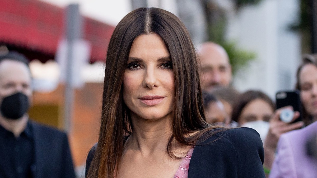 Sandra Bullock's teen son Louis towers over her in rare outing