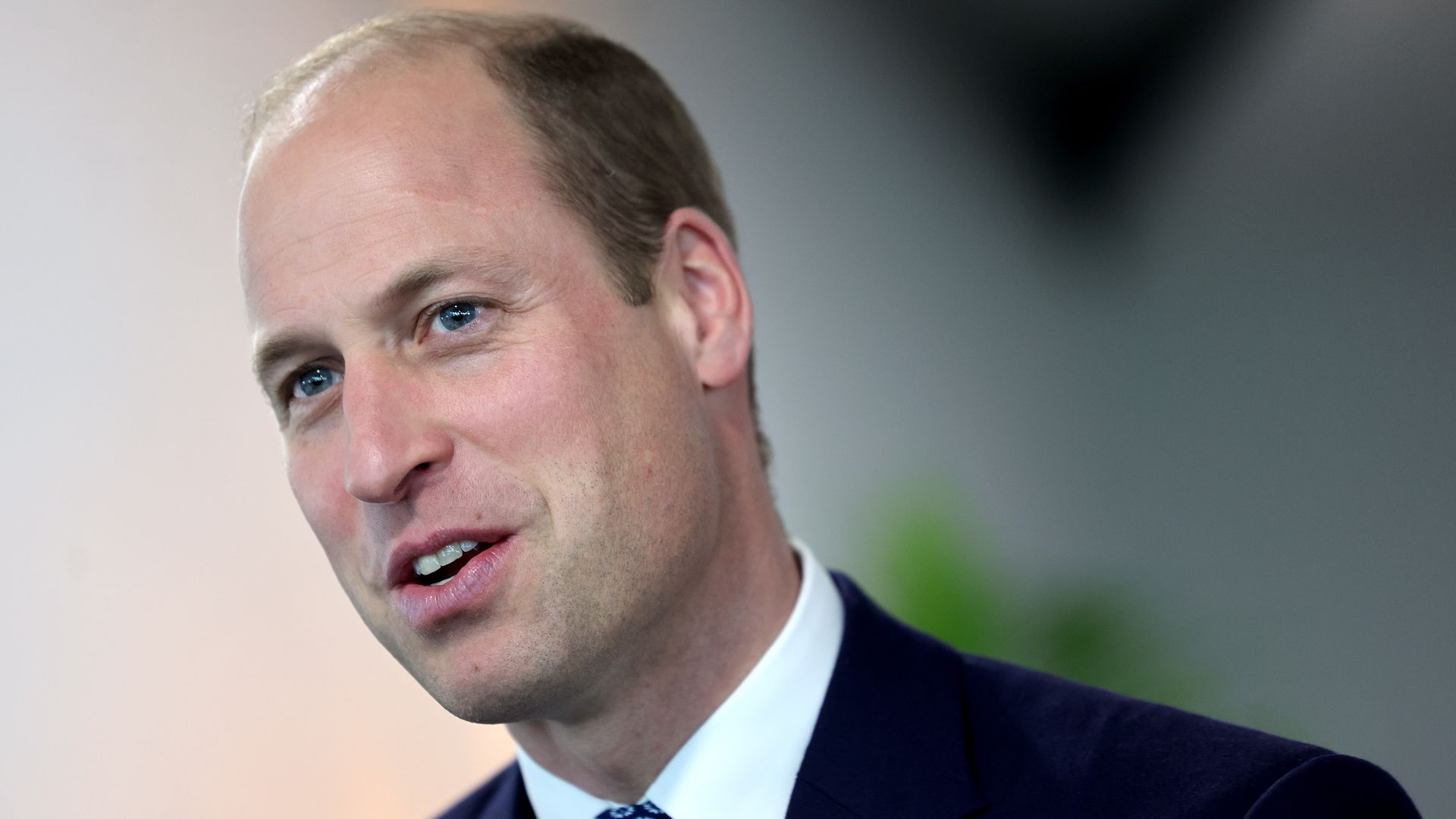 Prince William wearing a tie made from plastic bottles
