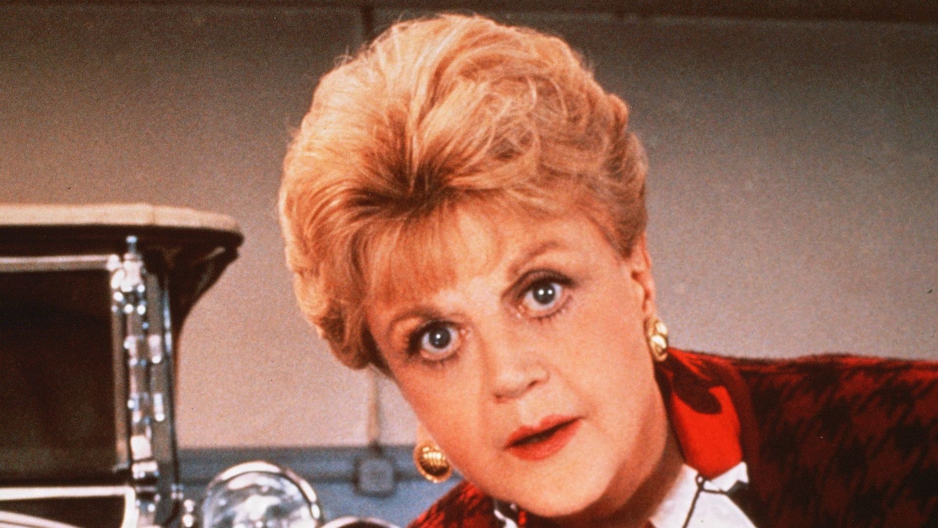 Angela Lansbury in Murder, She Wrote with a magnifying glass