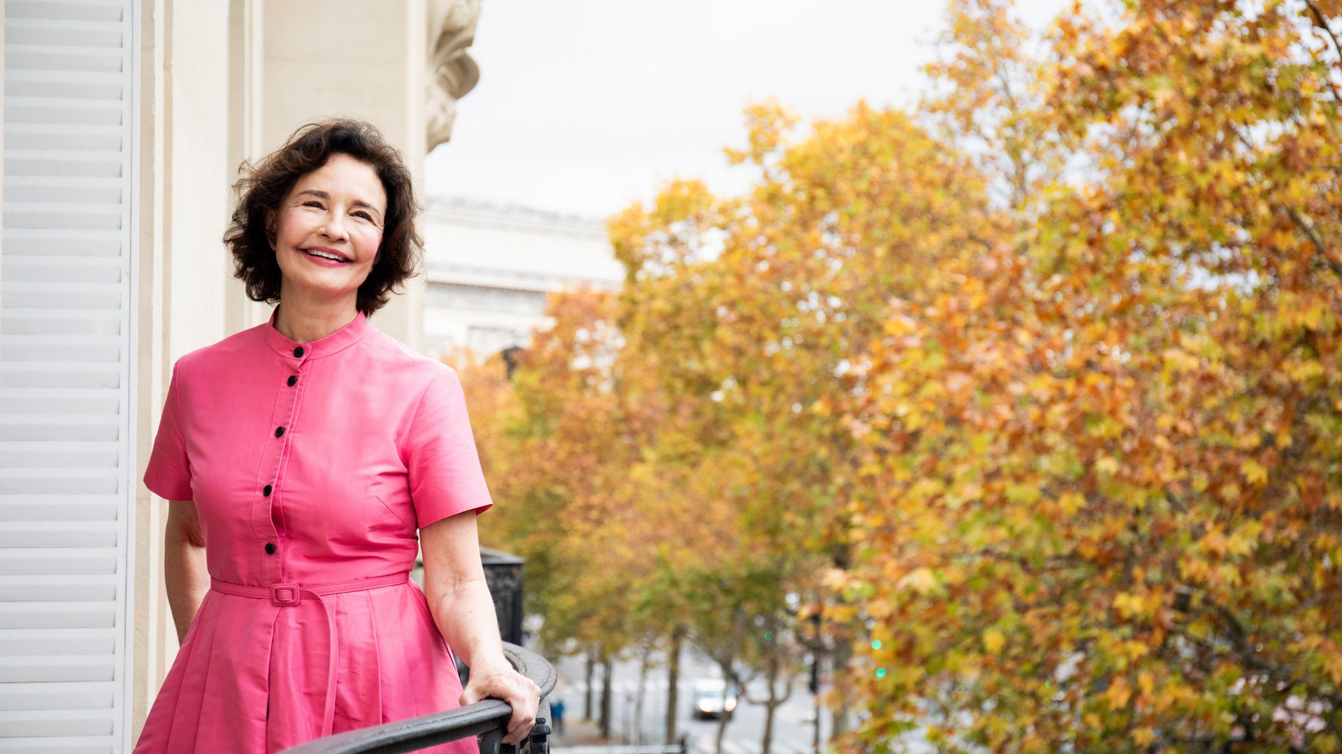 A photograph of Sonia Choquette stood on a balcony