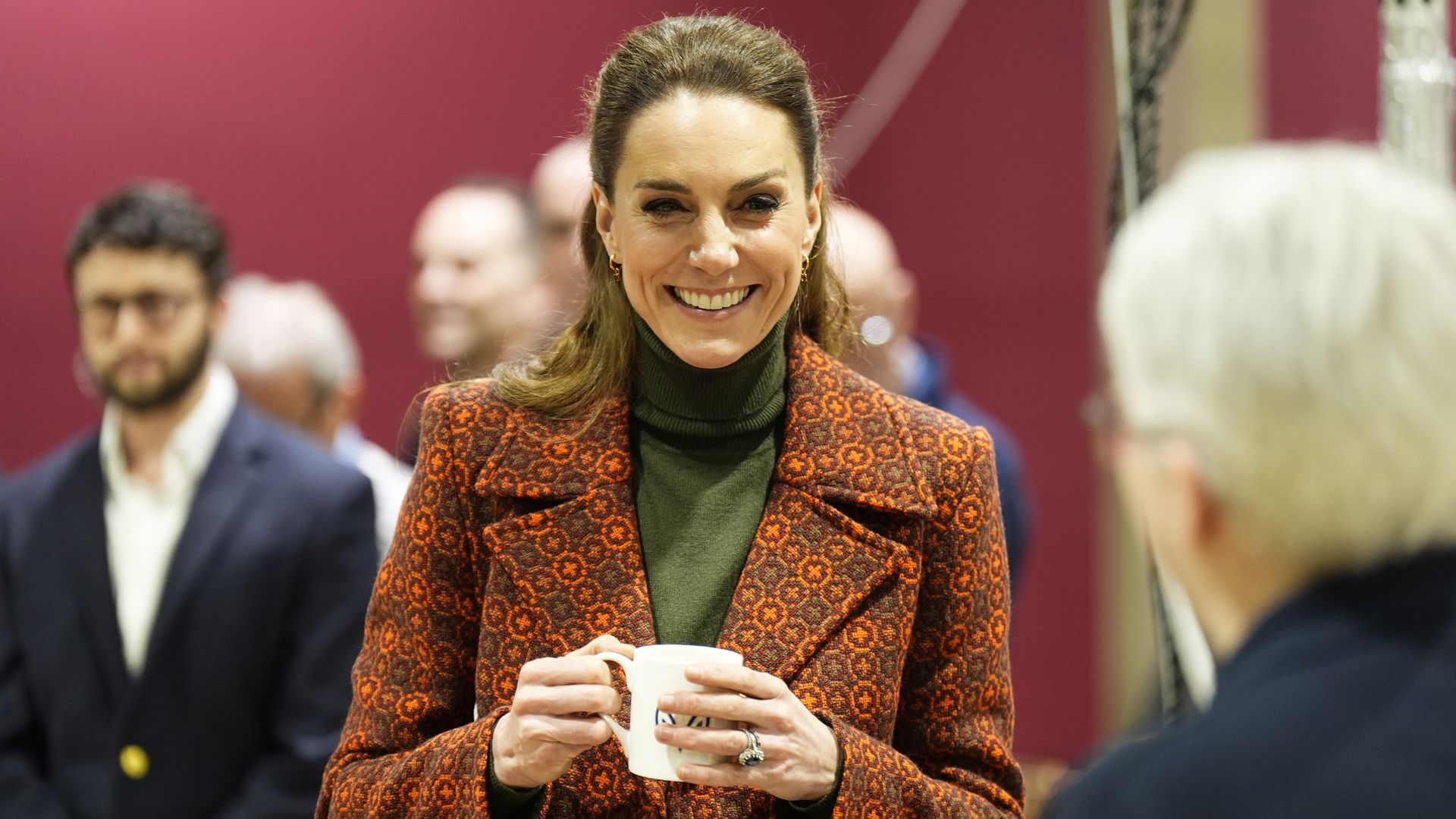 Catherine, Princess of Wales cuts material during a visit to Hiut Denim, a family-owned company designing and manufacturing premium jeans entirely in the UK, on February 3, 2026 