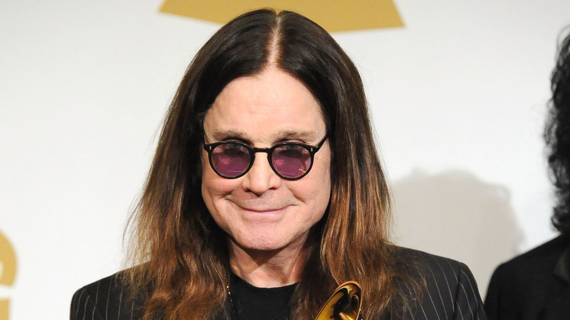 Ozzy Osbourne holding a Grammy Award