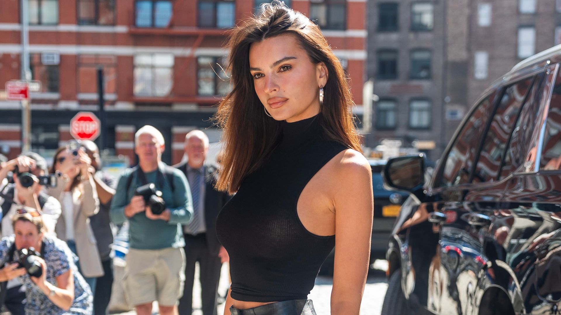 Emily Ratajkowski’s flared leather skirt is a slinky autumn staple