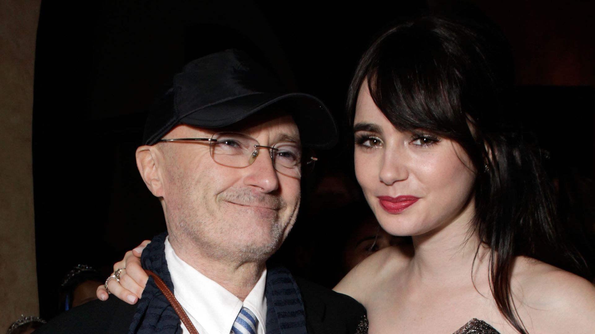 Musician Phil Collins and Actress Lily Collins attend the after party for Relativity Media's "Mirror Mirror" Los Angeles premiere at the Roosevelt Hotel on March 17, 2012 in Hollywood, California.