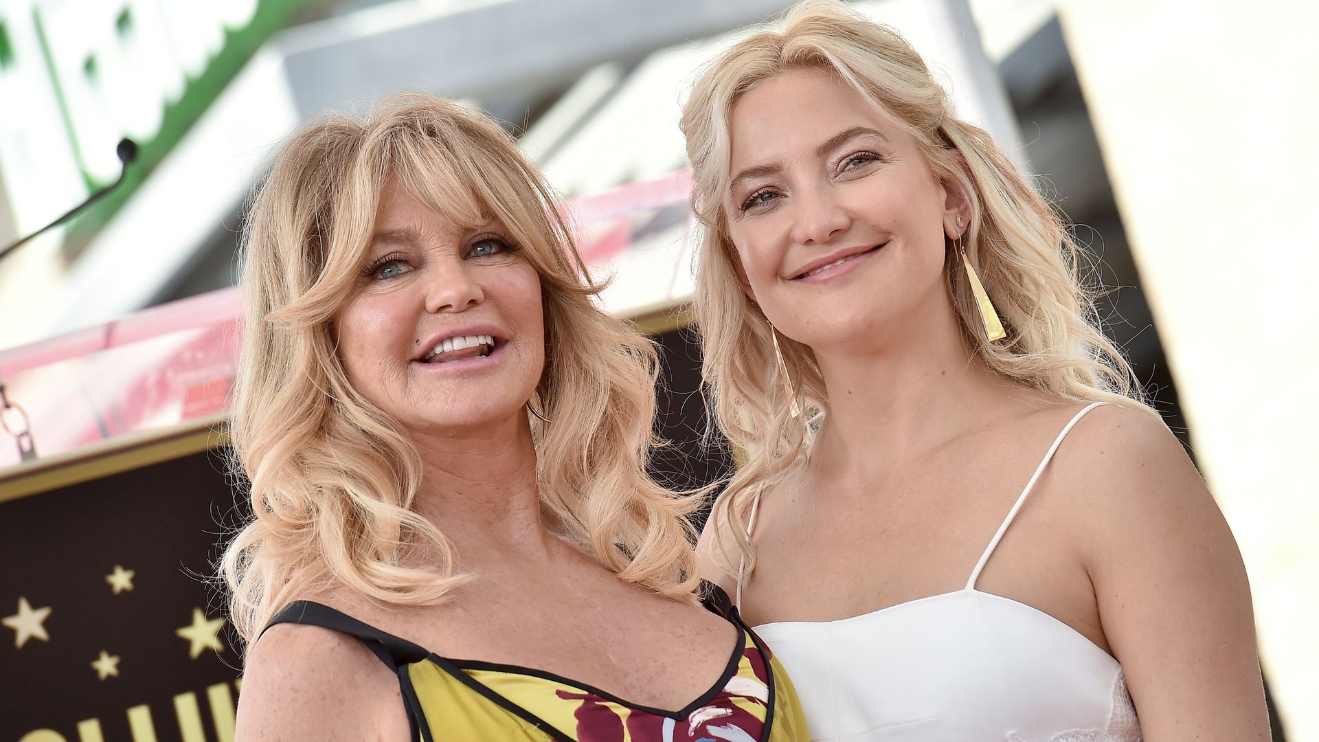 Goldie Hawn and Kate Hudson smiling on the red carpet
