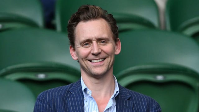Tom Hiddleston claps at Wimbledon. 