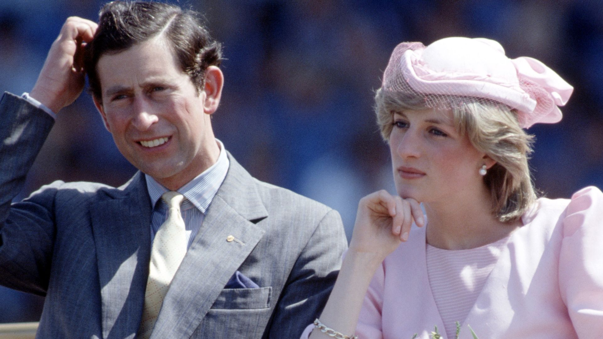 Prince Charles scratching his head and Princess Diana resting her head on her hand