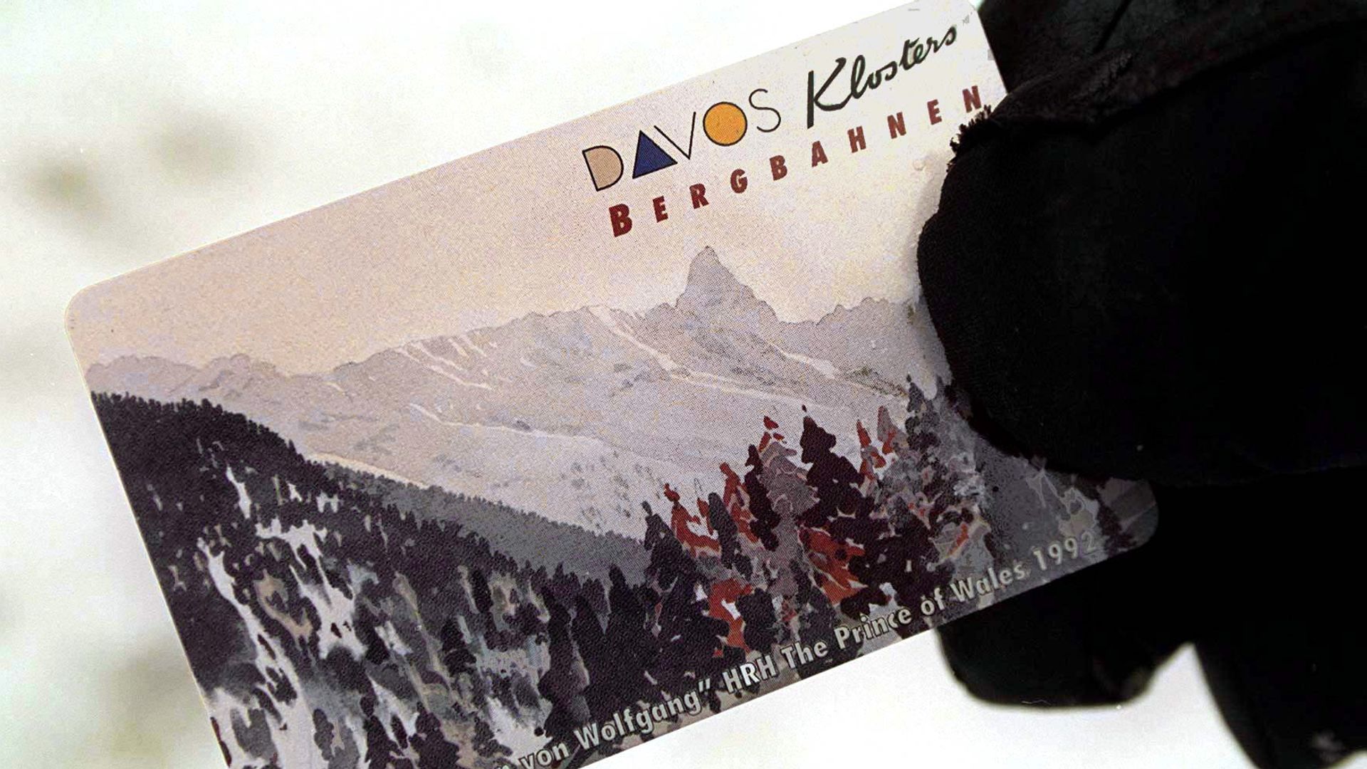 A ski pass featuring a watercolour painting of mountains and trees by King Charles