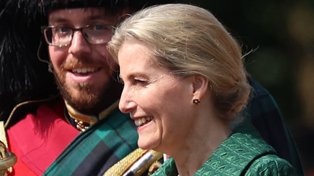 Sophie, Duchess of Edinburgh in green outfit with soldiers