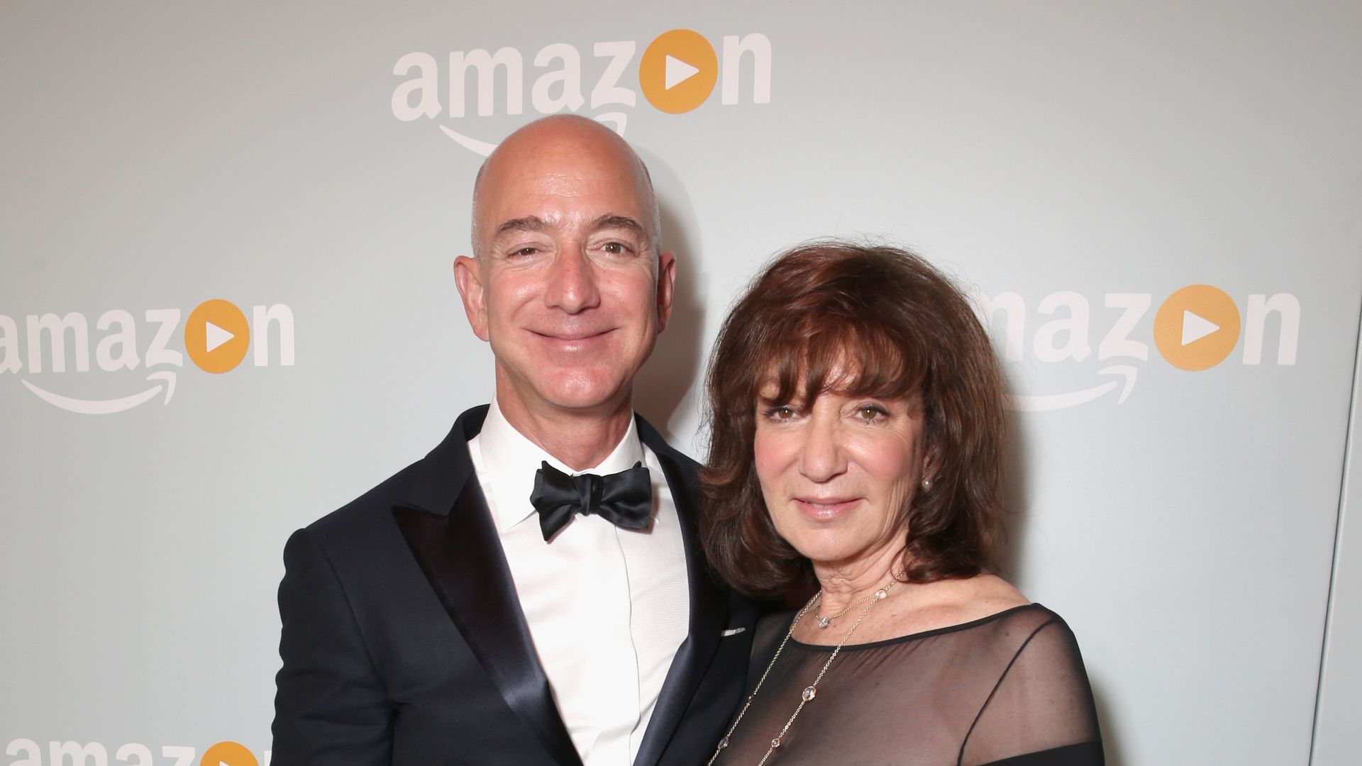 Jeff Bezos, CEO of Amazon.com, Inc. (L) and Jackie Bezos 