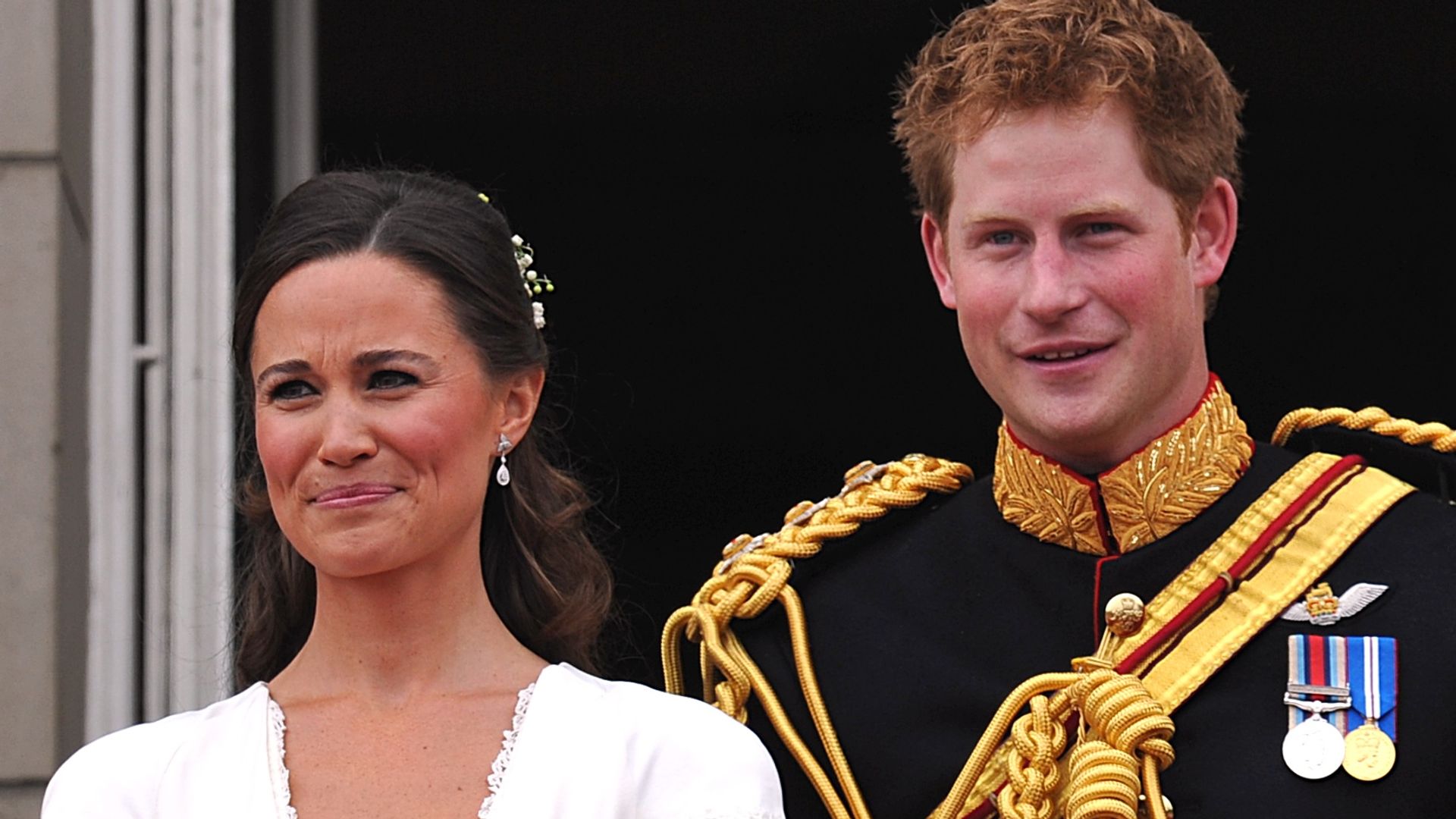 Prince Harry smiling next to maid of honour Pippa Middleton at Kate and William's 2011 wedding