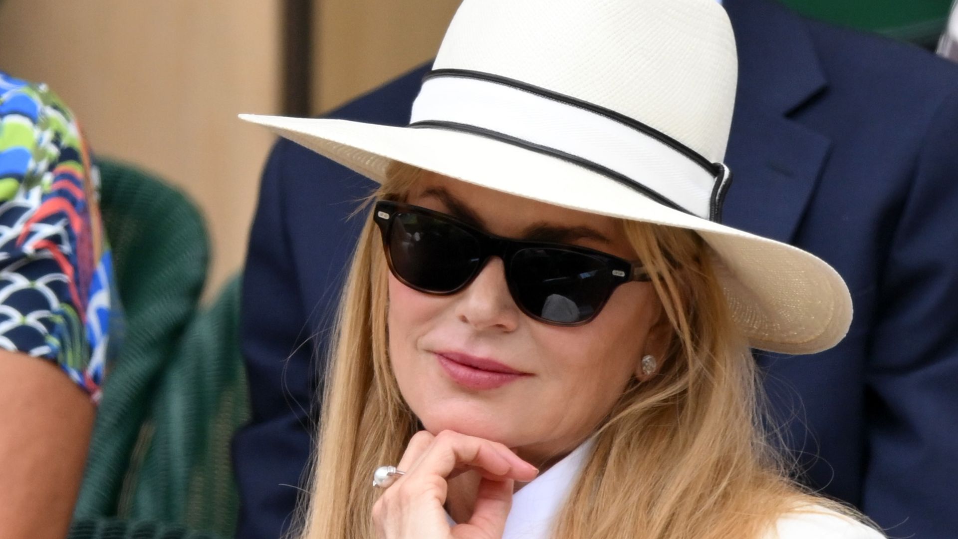 photo of nicole kidman wearing white suit and hat and sunglasses watching wimbledon tennis