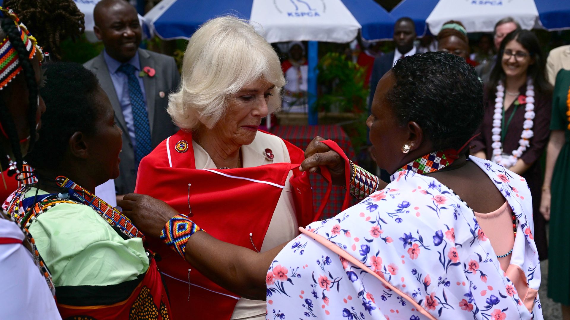 Queen Camilla being presented with traditional regalia while in Kenya