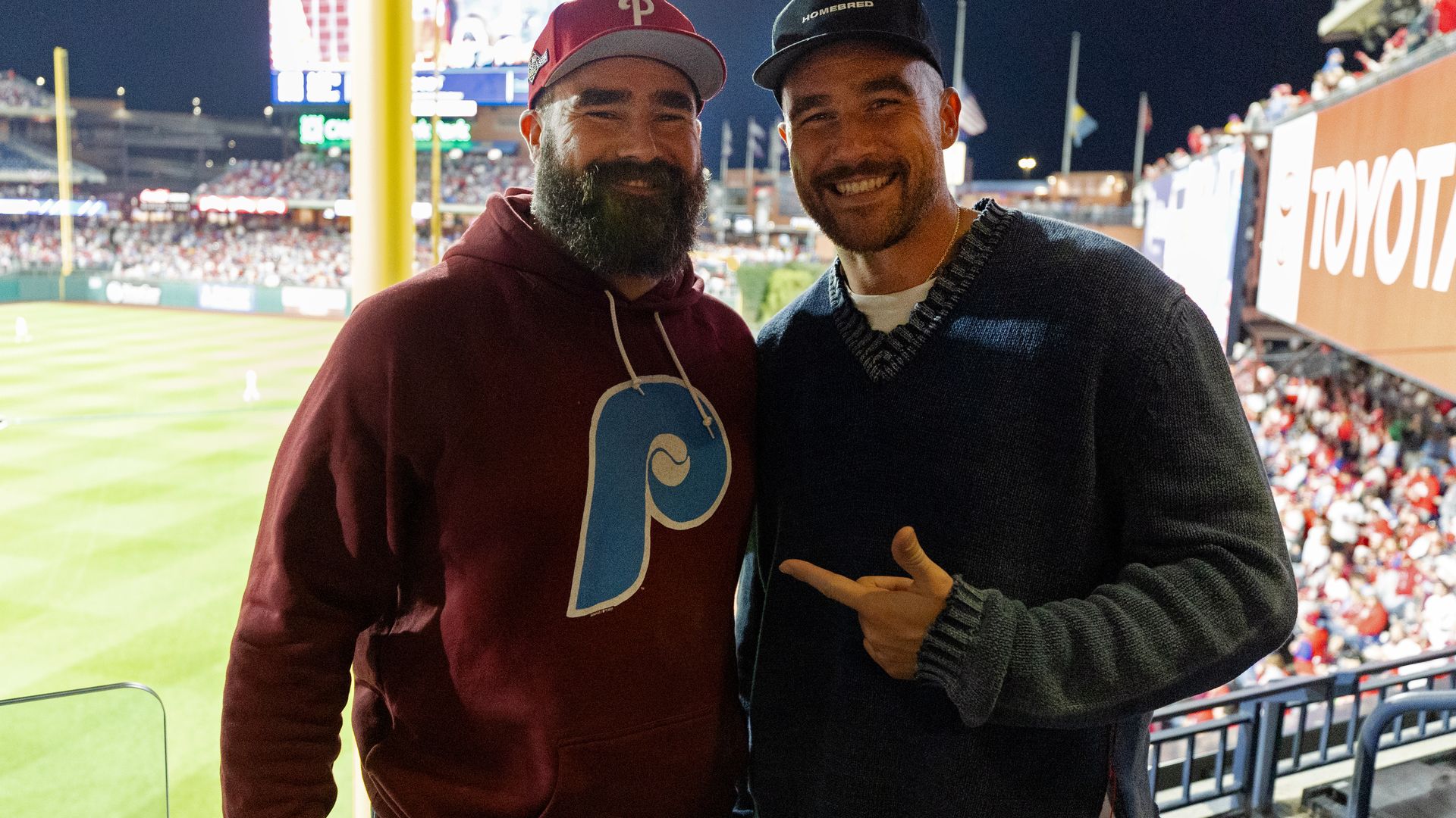 Jason and Travis Kelce pose for a photo during Game 1 of the NLCS between the Arizona Diamondbacks and the Philadelphia Phillies at Citizens Bank Park 
