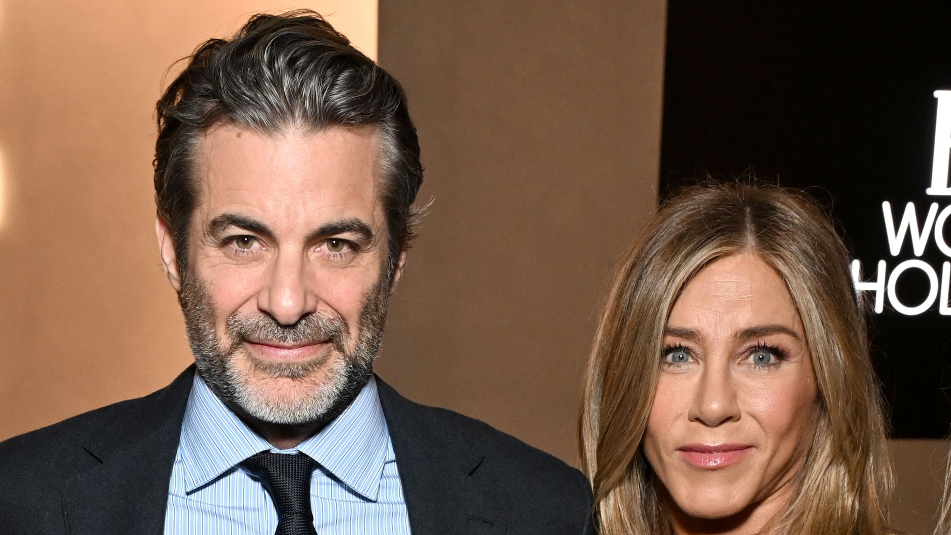 Jim Curtis and Jennifer Aniston, wearing Ralph Lauren, attend ELLE's 2025 Women in Hollywood Celebration presented by Ralph Lauren and Bvlgari with support from evian, Hendrick's Gin, and Lucid Motors on November 17, 2025 in Los Angeles, California