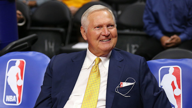 Golden State Warriors executive board member Jerry West sits on the bench by NBA logos before the game the Los Angeles Clippers at Staples Center on March 31, 2015 in Los Angeles, California