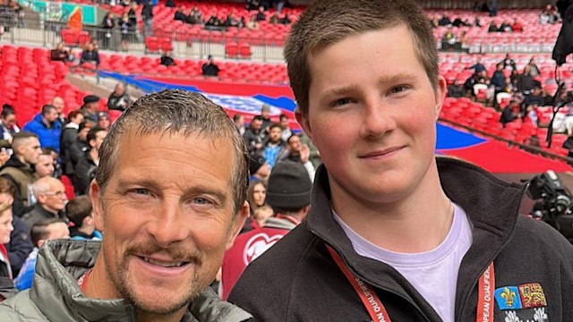 Bear with son at stadium