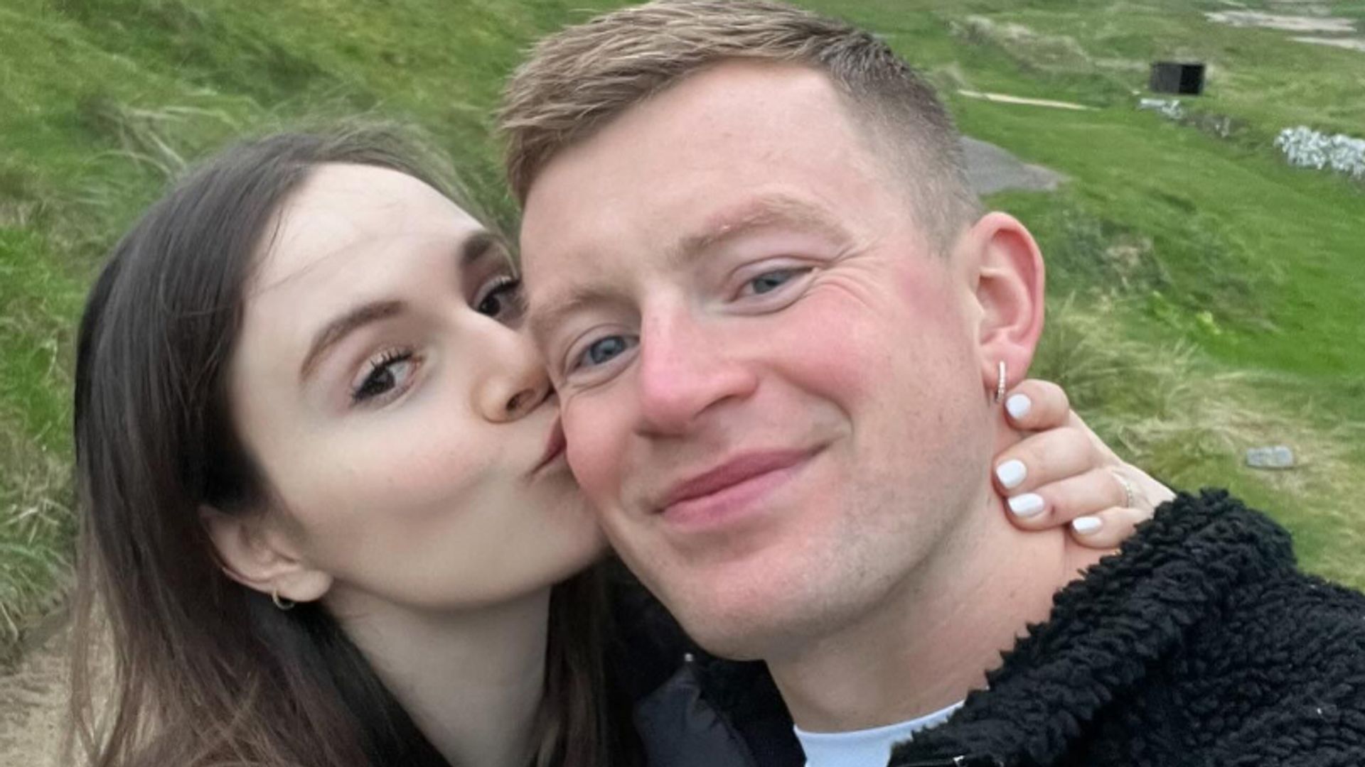 Holly Ramsay kissing Adam Peaty's cheek