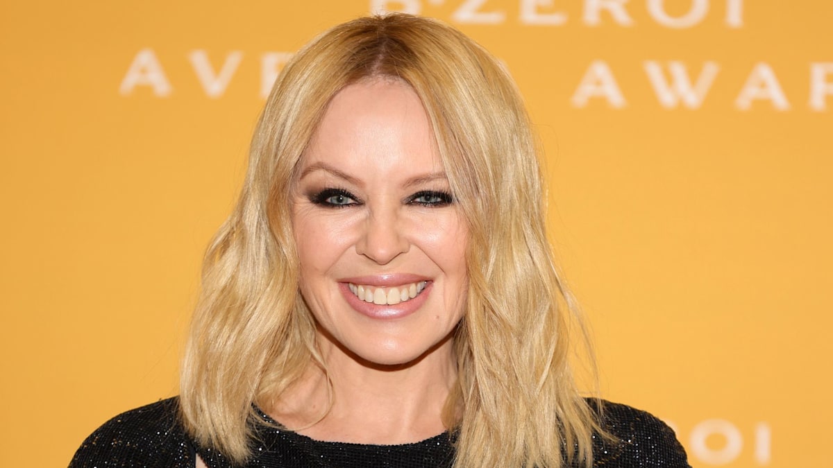 Kylie Minogue is unrecognisable with head-turning curls and skintight ...