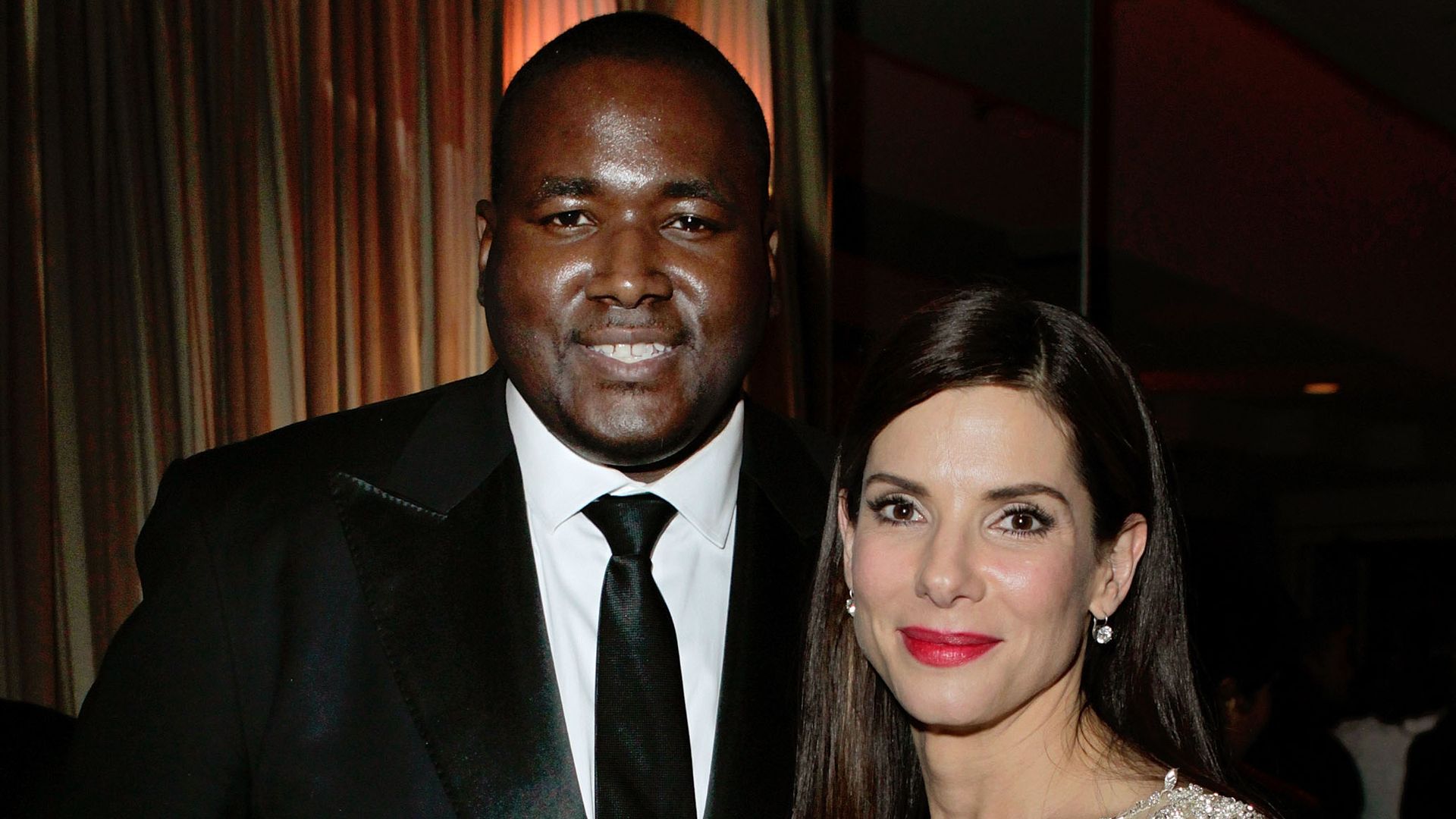 Quinton Aaron and Sandra Bullock attend the 2010 Vanity Fair Oscar Party at the Sunset Tower Hotel on March 7, 2010 in West Hollywood, California