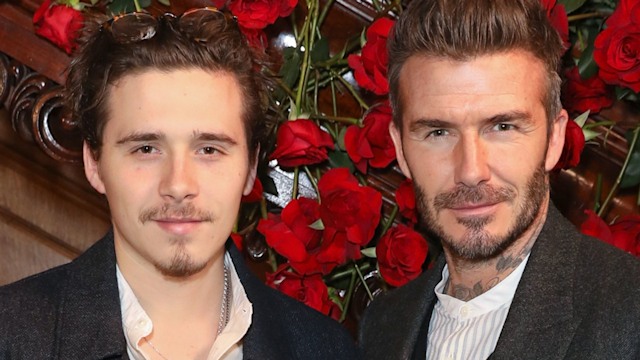 David Beckham with his son Brooklyn Beckham in front of red roses