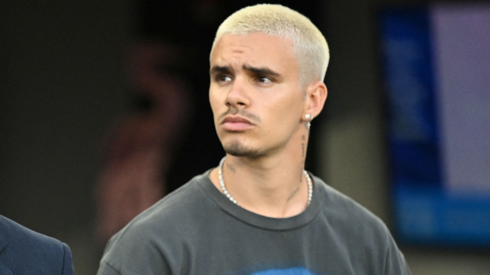 Inter Miami's co-owner David Beckham and his son Romeo James Beckham stand for the National Anthem before the Major League Soccer (MLS) regular season soccer match between Inter Miami CF and Nashville SC at Chase Stadium 