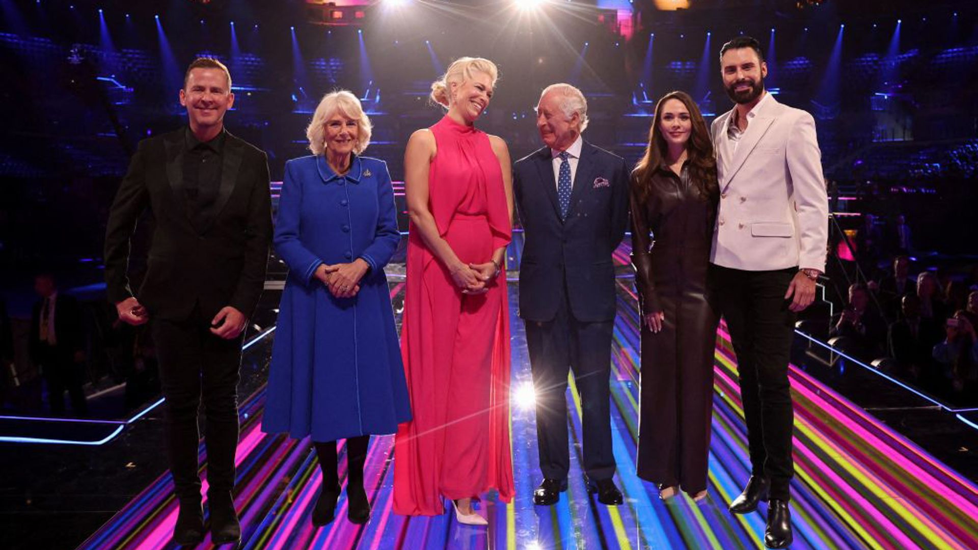 Rylan poses for a photo with King Charles, Queen Camilla, Scott Mills, Hannah Waddingham and Julia Sanina 
