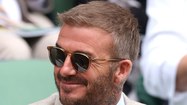 david beckham smiling at wimbledon