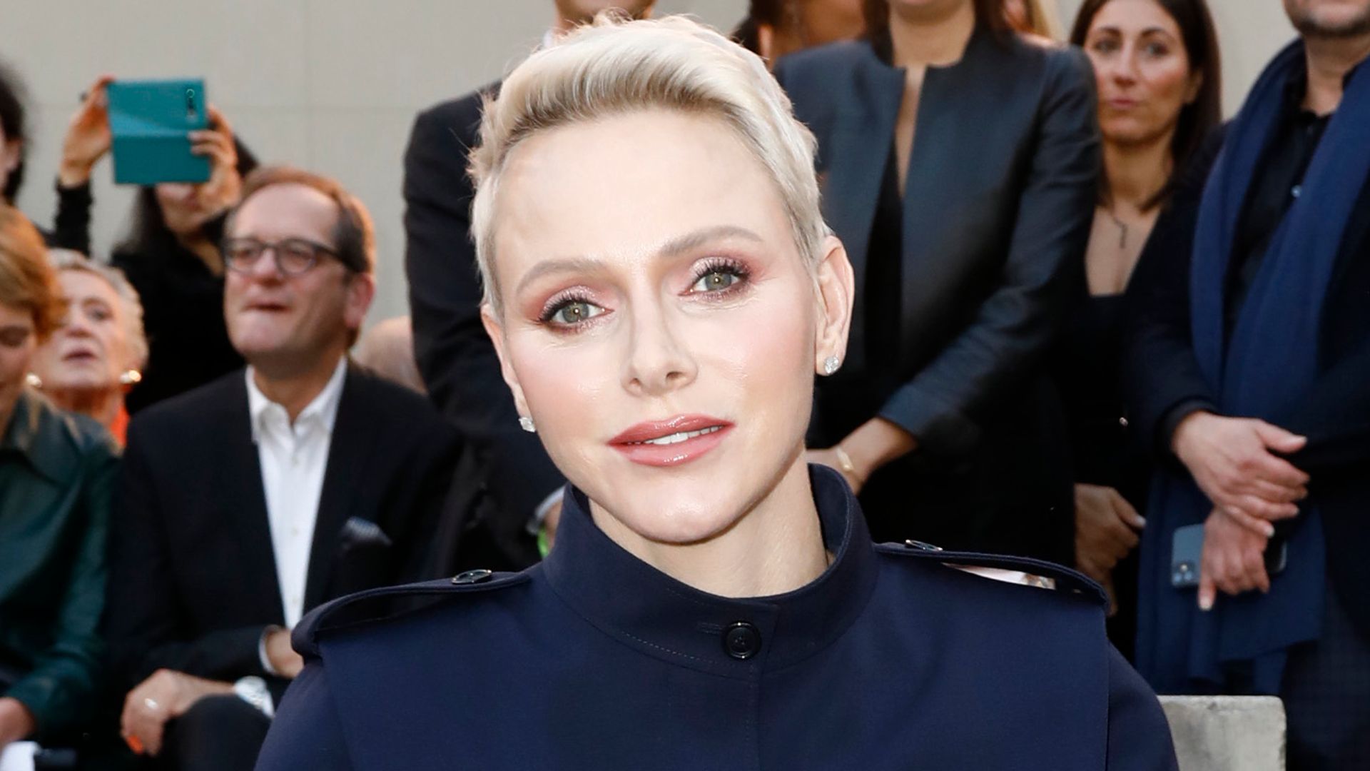 Princess Charlene rocks snatched suit and icy blonde pixie cut on front row at Paris Fashion Week