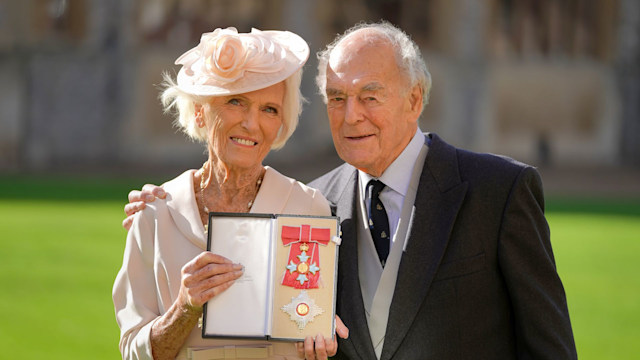 Mary Berry in a cream dress with Paul Hunnings in a black suit