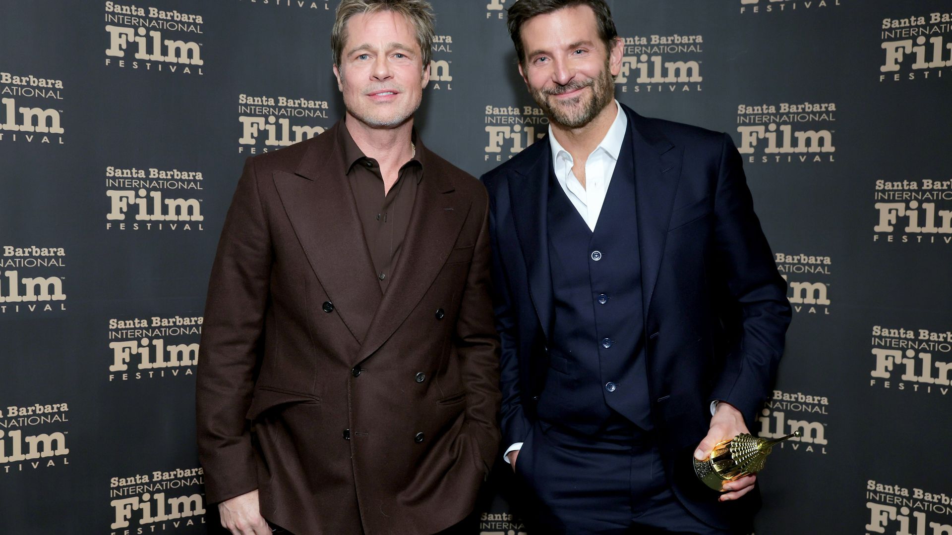 Brad Pitt and Honoree Bradley Cooper pose with the Outstanding Performer of the Year Award 