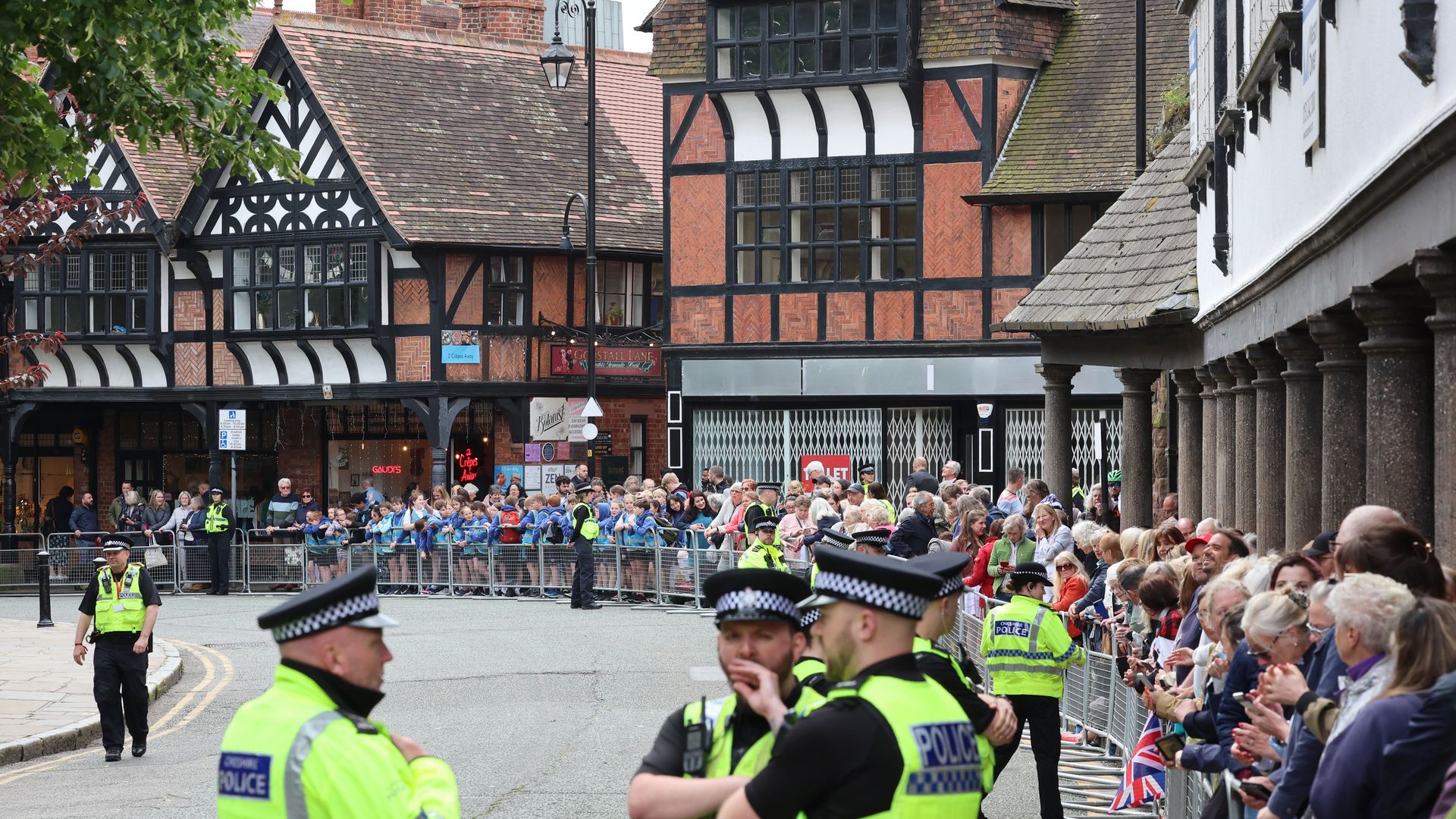 A general view of aolice and well-wishers as they line the street ahead of the wedding of The Duke of Westminster and Miss Olivia Henson at Chester Cathedral