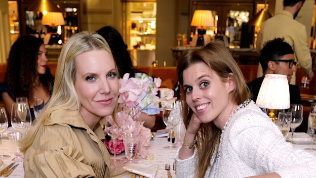 two women sitting at dinner table