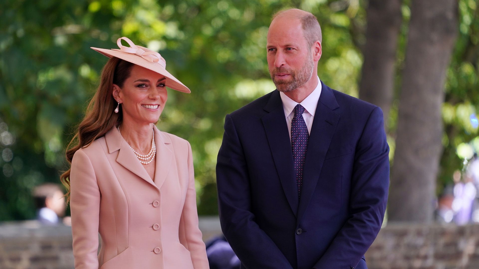 William and Kate smiling during French state visit in Windsor