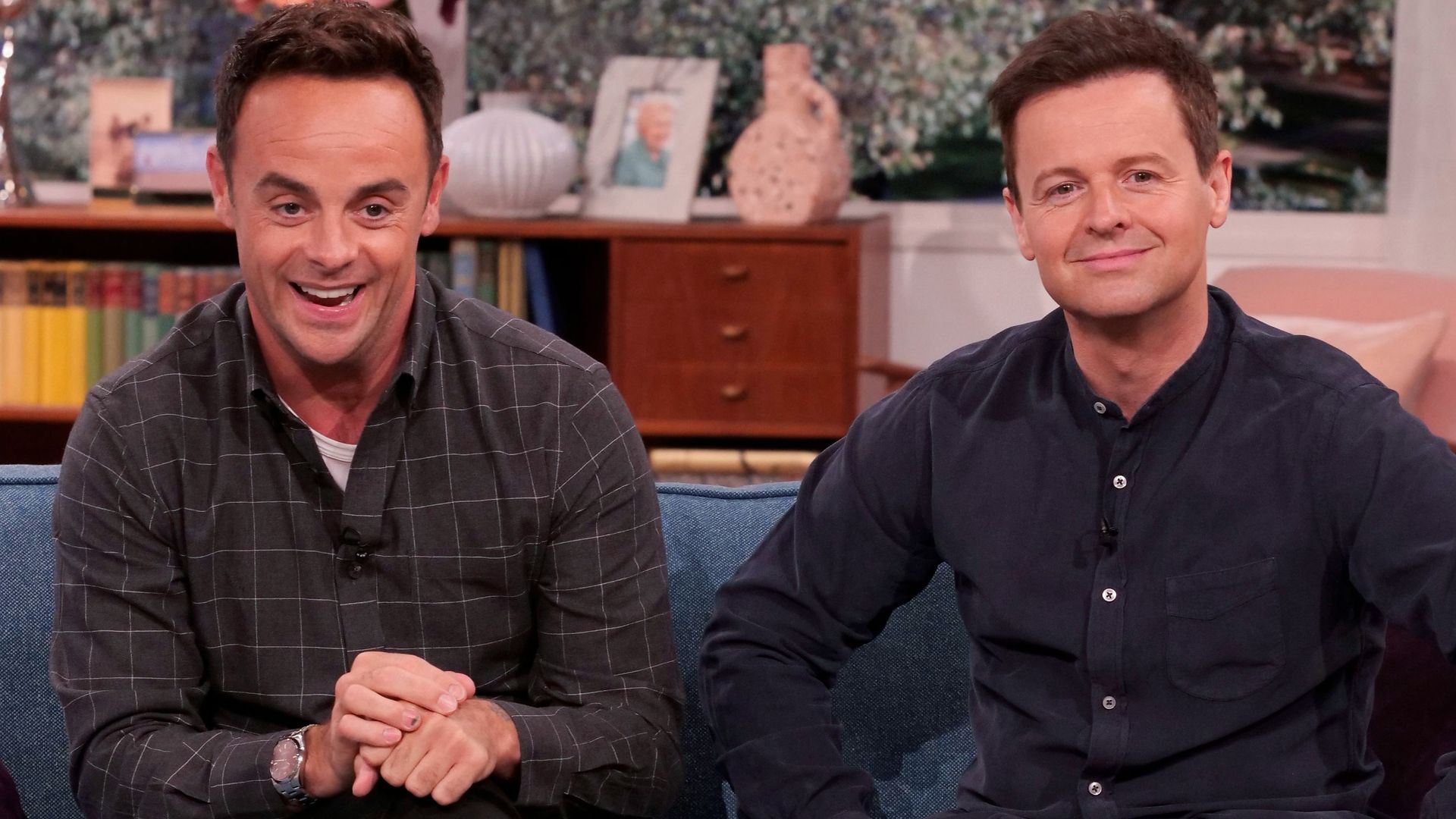 Anthony McPartlin and Declan Donnelly sitting on a blue sofa
