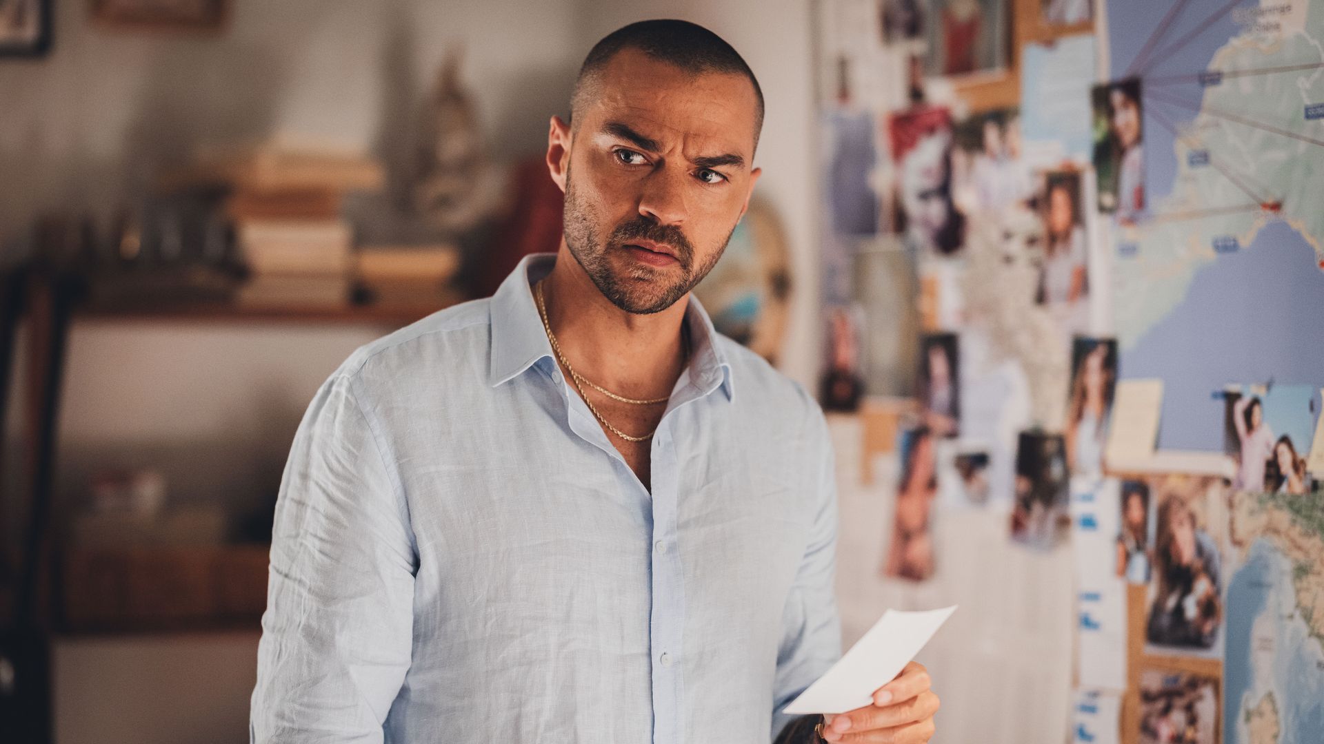 man holding piece of paper in flat
