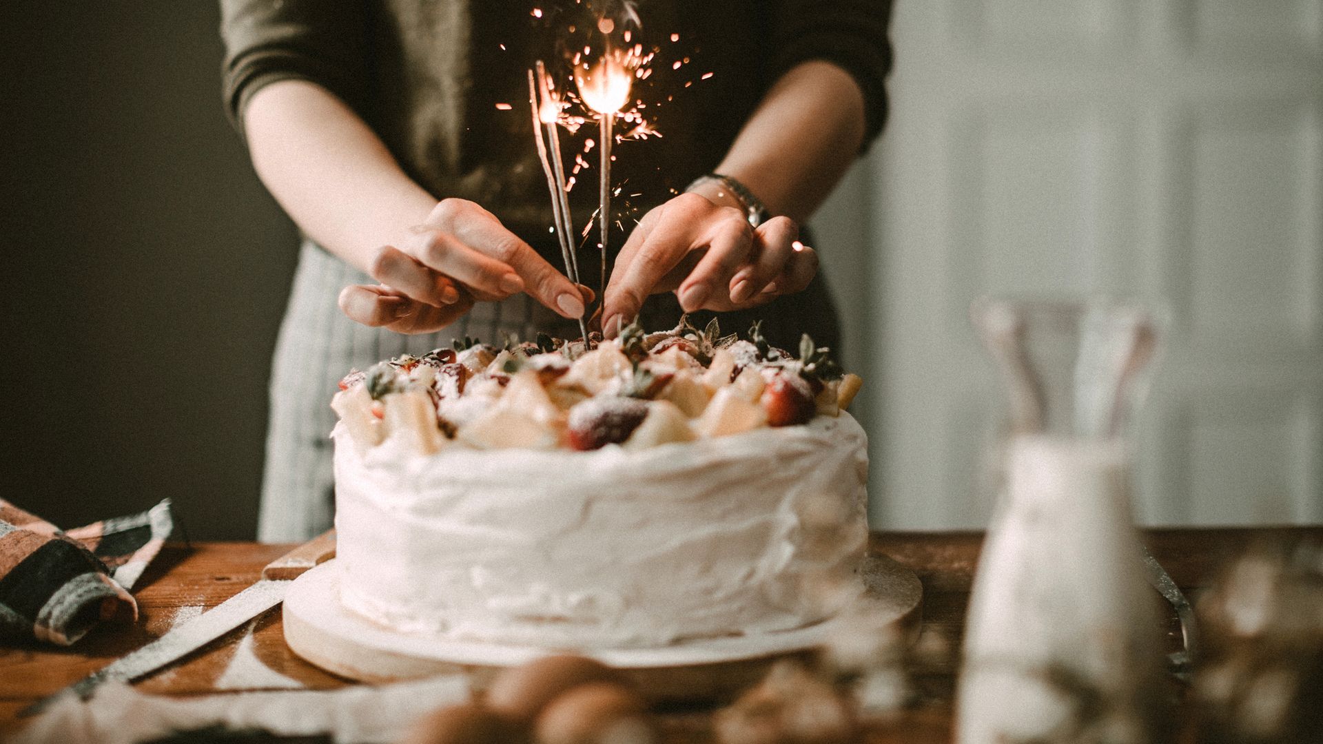 Woman making cake for celebration