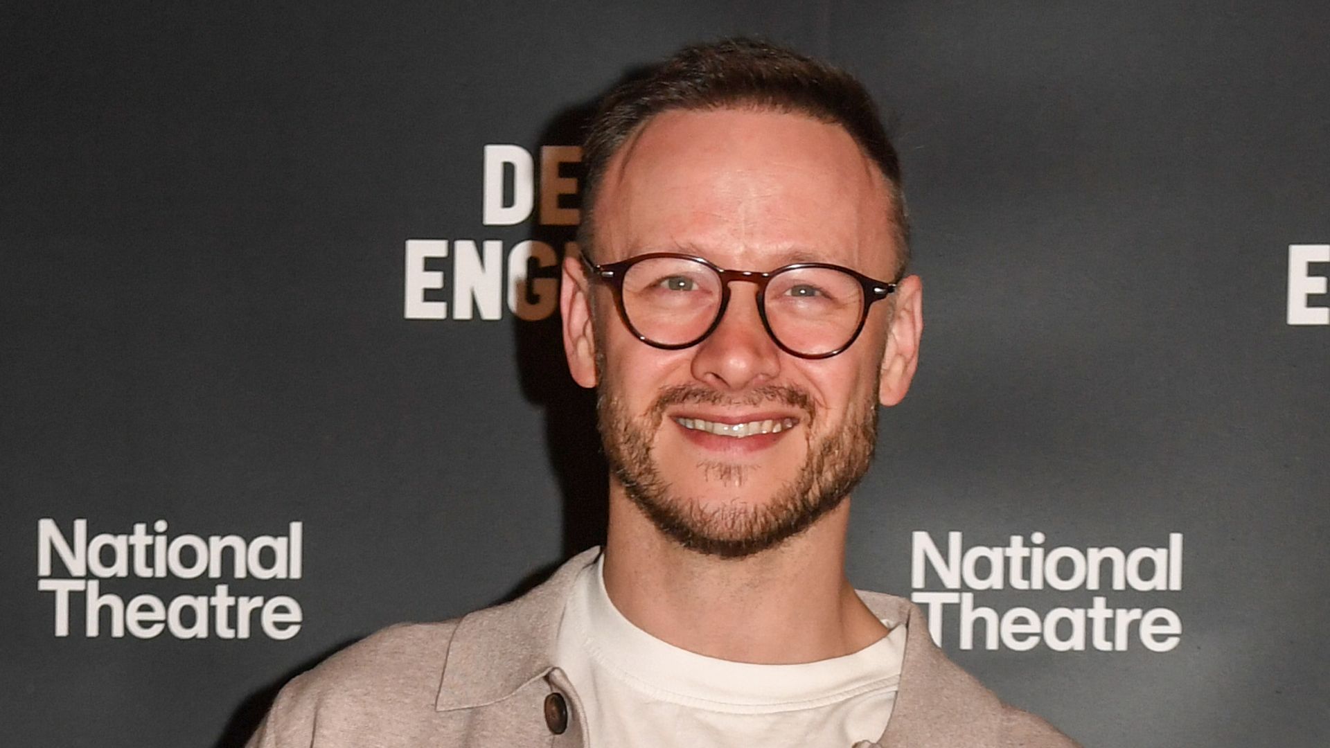 Kevin Clifton in a blazer and trousers