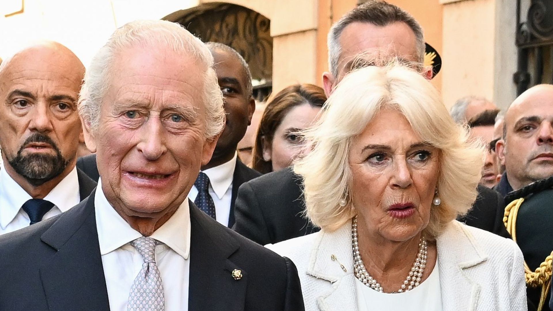 king charles and queen camilla walking through Rome