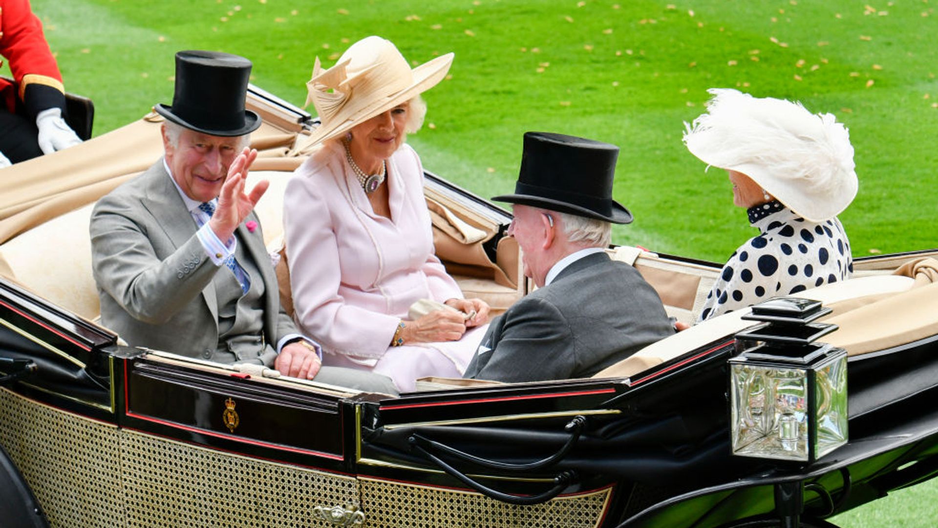 King Charles III and Queen Consort Camilla riding in a carriage at day two of Royal Ascot 2023.